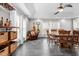 Open dining room with a bar area, guitars, and a rustic wooden table at 115 N Oakland Dr, Mebane, NC 27302