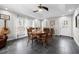 Bright dining room featuring a round wood table and views from several windows at 115 N Oakland Dr, Mebane, NC 27302