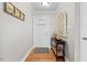 A welcoming foyer with wood floors and a decorative table sets a warm and inviting tone at 115 N Oakland Dr, Mebane, NC 27302