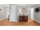 Hallway with hardwood floors and neutral decor at 115 N Oakland Dr, Mebane, NC 27302