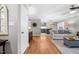Open living room connects to the kitchen with hardwood floors at 115 N Oakland Dr, Mebane, NC 27302