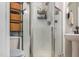 Compact full bathroom features a standing shower with see through glass doors and a toilet with storage at 11843 Canemount St, Raleigh, NC 27614