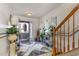 Warm foyer featuring a decorative rug and staircase to the right at 11843 Canemount St, Raleigh, NC 27614