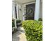 Charming front door with a floral wreath and well-maintained greenery, creating an inviting entrance at 11843 Canemount St, Raleigh, NC 27614