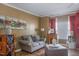 Comfortable living room with a cozy fireplace and plush seating at 11843 Canemount St, Raleigh, NC 27614