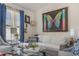Bright living room with a comfortable white couch and plenty of natural light from large windows at 11843 Canemount St, Raleigh, NC 27614