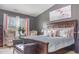 This bedroom provides ample space, natural light, stylish decor, and a soothing ambiance for rest and rejuvenation at 11843 Canemount St, Raleigh, NC 27614