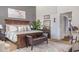 Bright bedroom features a wooden bedframe, gray walls, and a comfortable seating area for relaxing or reading at 11843 Canemount St, Raleigh, NC 27614