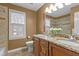 Bathroom featuring granite countertop, double sinks and a shower/tub combo at 1212 Eastham Dr, Apex, NC 27502