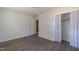 Bright bedroom with wood-look floors, closet, and neutral walls, perfect for creating a relaxing retreat at 1216 York St, Rocky Mount, NC 27803