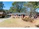 Attractive single-story brick home features a well-manicured lawn and traditional architectural style at 1216 York St, Rocky Mount, NC 27803