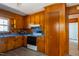 Traditional kitchen with wood cabinets, essential appliances, and a functional workspace at 1216 York St, Rocky Mount, NC 27803