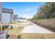 Newly landscaped backyard featuring a concrete patio and vibrant green space at 122 Weavers Grove Dr, Chapel Hill, NC 27514