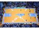 Aerial view of a basketball court in a stadium filled with cheering fans at 122 Weavers Grove Dr, Chapel Hill, NC 27514