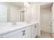 Bright bathroom with double vanity, white cabinets, and access to a tiled shower/tub at 122 Weavers Grove Dr, Chapel Hill, NC 27514