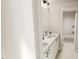 Bright bathroom features a double sink vanity, modern fixtures, and a view of the shower/tub combination at 122 Weavers Grove Dr, Chapel Hill, NC 27514