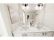 Bathroom featuring dual sinks, a large mirror, and contemporary lighting fixtures at 122 Weavers Grove Dr, Chapel Hill, NC 27514