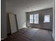 Bright room with natural light from two windows, a door and neutral paint, ready for personalization at 122 Weavers Grove Dr, Chapel Hill, NC 27514