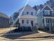 Charming two-story home with a red door, white trim, and a welcoming front porch on a sunny day at 122 Weavers Grove Dr, Chapel Hill, NC 27514