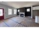 Spacious living room with a cozy fireplace, lots of natural light, and is ready for your personal touches at 122 Weavers Grove Dr, Chapel Hill, NC 27514
