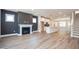 Spacious living room featuring a fireplace, modern floors and open concept design at 122 Weavers Grove Dr, Chapel Hill, NC 27514