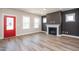 Open living room featuring a fireplace and lots of natural light at 122 Weavers Grove Dr, Chapel Hill, NC 27514