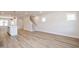 Open concept living room with access to the modern kitchen and staircase at 122 Weavers Grove Dr, Chapel Hill, NC 27514