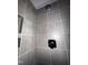 Modern shower with gray tiles and a built-in shampoo niche at 122 Weavers Grove Dr, Chapel Hill, NC 27514