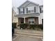 Charming two-story townhome with a stone-accented porch and well-maintained landscaping at 1304 Cozart St # 414, Durham, NC 27704