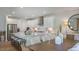 Spacious white kitchen with modern appliances, center island, and stylish stools perfect for cooking and entertaining at 136 Blue Butterfly Dr, Angier, NC 27501
