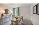 Home office with a desk, chair, lamps, and a round mirror on wall at 136 Blue Butterfly Dr, Angier, NC 27501