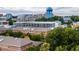 An aerial view shows a neighborhood of brick buildings and UNC's blue water tower at 138 Weavers Grove Dr, Chapel Hill, NC 27514