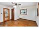 Bedroom featuring hardwood floors, a window, and closet with mirror at 1418 Kirkwood Drive Dr, Durham, NC 27705