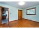 Bedroom showing natural light and a glimpse into the adjacent kitchen at 1418 Kirkwood Drive Dr, Durham, NC 27705