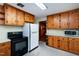 Functional kitchen featuring classic wood cabinets and standard appliances for easy meal preparation at 1418 Kirkwood Drive Dr, Durham, NC 27705