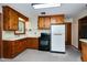 Functional kitchen featuring classic wood cabinets and standard appliances for easy meal preparation at 1418 Kirkwood Drive Dr, Durham, NC 27705