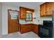 Functional kitchen featuring classic wood cabinets and standard appliances for easy meal preparation at 1418 Kirkwood Drive Dr, Durham, NC 27705