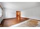 Bright and airy living room featuring hardwood floors and large window for plenty of natural light at 1418 Kirkwood Drive Dr, Durham, NC 27705