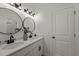 Modern bathroom featuring dual sinks, elegant mirrors, and stylish lighting for a luxurious feel at 1604 Palmer Dr, Graham, NC 27253