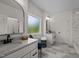Bright bathroom featuring double vanities, sleek mirrors, and modern fixtures at 1604 Palmer Dr, Graham, NC 27253