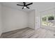 Bright bedroom with gray flooring, great natural light, and serene atmosphere, making it a perfect oasis at 1604 Palmer Dr, Graham, NC 27253