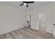 Spacious bedroom with modern gray flooring, offering versatile living with easy access to other rooms at 1604 Palmer Dr, Graham, NC 27253