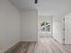 Sunlit bedroom featuring wood-look flooring, white walls, and a bright, airy feel at 1604 Palmer Dr, Graham, NC 27253