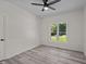 Bright and airy bedroom with new gray flooring and ample natural light, a serene space at 1604 Palmer Dr, Graham, NC 27253