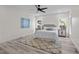 Well-lit bedroom with a comfortable bed, plush rug, and bright natural light at 1604 Palmer Dr, Graham, NC 27253