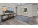 Bright foyer with a decorative rug and french doors, leading into the home's main living areas at 1604 Palmer Dr, Graham, NC 27253