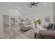 Spacious living room with a ceiling fan, comfortable seating, and access to an outdoor deck area at 1604 Palmer Dr, Graham, NC 27253