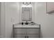 Stylish powder room with a modern vanity, sleek mirror, and elegant decor at 1604 Palmer Dr, Graham, NC 27253