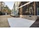 Spacious concrete back patio with stairs leading to the backyard, perfect for outdoor gatherings at 1636 Sweetwater Ln, Raleigh, NC 27610