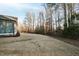 View of the home and backyard showcasing the landscaping and trees surrounding the property at 1636 Sweetwater Ln, Raleigh, NC 27610